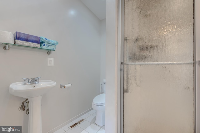 2409 Lightfoot Dr, Baltimore, MD 21209 - bathroom with a stall shower, tile patterned flooring, toilet, and a sink