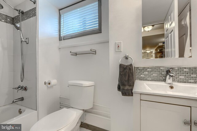 2409 Lightfoot Dr, Baltimore, MD 21209 - bathroom with toilet, vanity, bathing tub / shower combination, and decorative backsplash