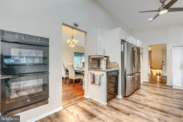 2409 Lightfoot Dr, Baltimore, MD 21209 - kitchen featuring black appliances, light wood-style floors, white cabinetry, a chandelier, and decorative backsplash