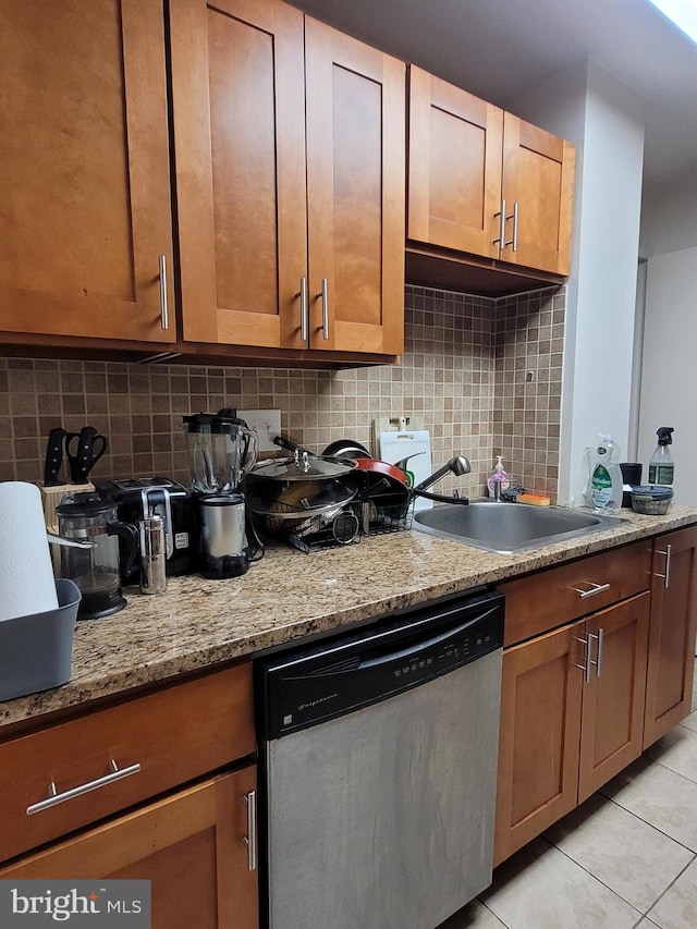 224 W Rittenhouse Sq Unit 2701, Philadelphia, PA 19103 - kitchen with stainless steel dishwasher, light tile patterned floors, tasteful backsplash, and light stone counters