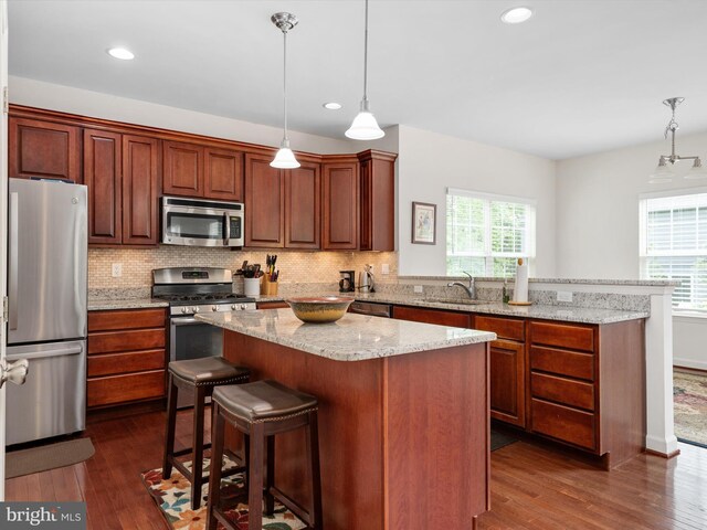 83 Clarence Ave, Severna Park, MD 21146 - kitchen featuring stainless steel appliances, a sink, healthy amount of natural light, tasteful backsplash, and recessed lighting