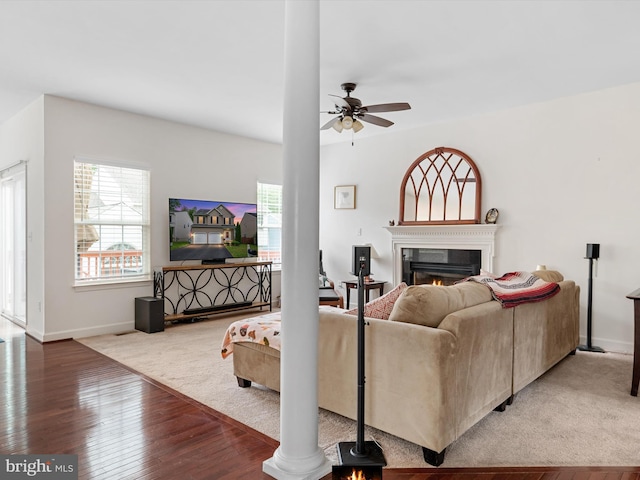 83 Clarence Ave, Severna Park, MD 21146 - living area with plenty of natural light, a ceiling fan, a lit fireplace, and wood finished floors
