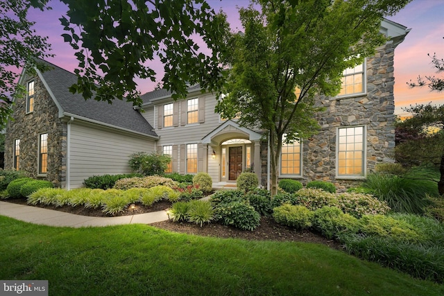 1 Derbyshire Way, Wilmington, DE 19807 - view of front of home with stone siding, a lawn, and a shingled roof