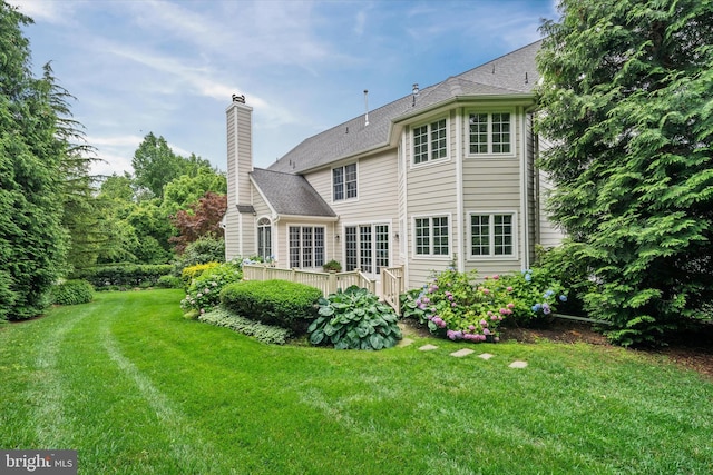1 Derbyshire Way, Wilmington, DE 19807 - back of house featuring a chimney, a yard, and a deck