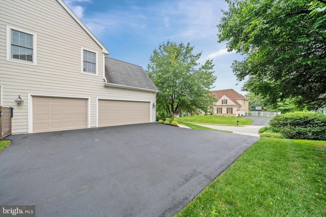 1 Derbyshire Way, Wilmington, DE 19807 - view of side of property featuring asphalt driveway and a lawn