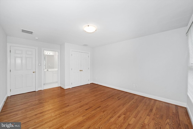 1 Derbyshire Way, Wilmington, DE 19807 - unfurnished bedroom featuring light wood finished floors, a closet, and ensuite bathroom