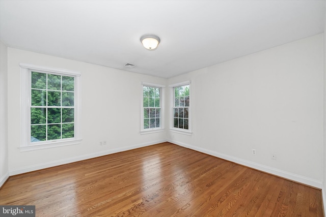 1 Derbyshire Way, Wilmington, DE 19807 - unfurnished room featuring wood finished floors and plenty of natural light