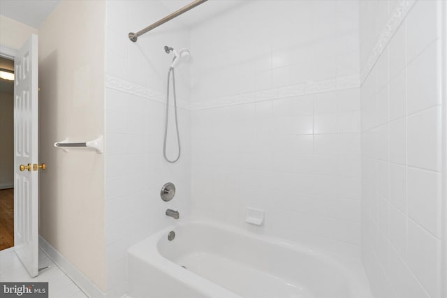 1 Derbyshire Way, Wilmington, DE 19807 - bathroom with washtub / shower combination and tile patterned flooring