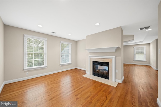 1 Derbyshire Way, Wilmington, DE 19807 - unfurnished living room with a high end fireplace, wood finished floors, and recessed lighting