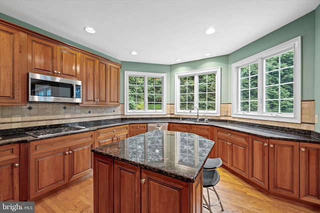 1 Derbyshire Way, Wilmington, DE 19807 - kitchen with appliances with stainless steel finishes, healthy amount of natural light, light wood-type flooring, brown cabinets, and recessed lighting