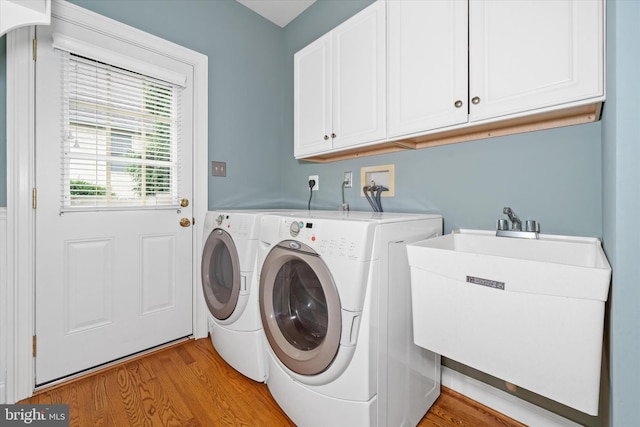1 Derbyshire Way, Wilmington, DE 19807 - laundry area featuring cabinet space, separate washer and dryer, and light wood-style flooring