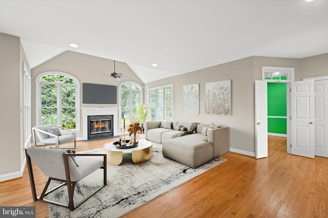 1 Derbyshire Way, Wilmington, DE 19807 - living area featuring a fireplace with flush hearth, ceiling fan, light wood-style flooring, lofted ceiling, and recessed lighting