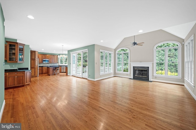 1 Derbyshire Way, Wilmington, DE 19807 - unfurnished living room featuring light wood-style floors, recessed lighting, a fireplace with flush hearth, ceiling fan, and a chandelier