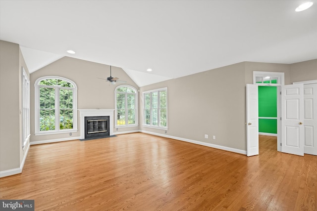 1 Derbyshire Way, Wilmington, DE 19807 - unfurnished living room featuring light wood-style flooring, a fireplace with flush hearth, a ceiling fan, lofted ceiling, and recessed lighting