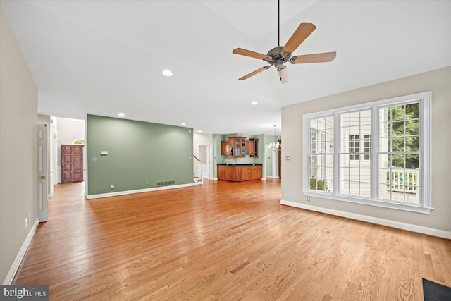 1 Derbyshire Way, Wilmington, DE 19807 - unfurnished living room featuring light wood-style flooring, a ceiling fan, a chandelier, and recessed lighting