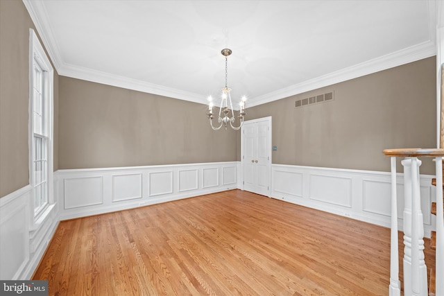 1 Derbyshire Way, Wilmington, DE 19807 - unfurnished room featuring a chandelier, ornamental molding, a wainscoted wall, and light wood finished floors