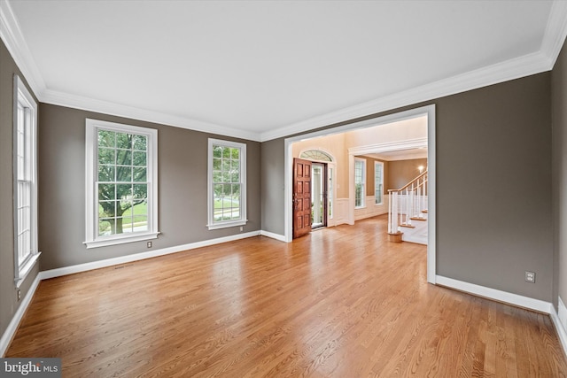 1 Derbyshire Way, Wilmington, DE 19807 - spare room with ornamental molding, light wood finished floors, and stairway