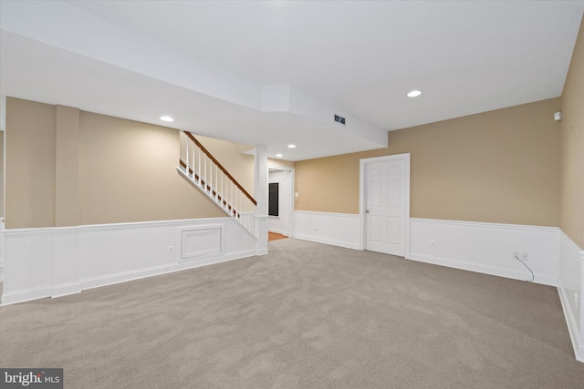 1 Derbyshire Way, Wilmington, DE 19807 - unfurnished living room featuring a wainscoted wall, carpet floors, stairway, recessed lighting, and a decorative wall