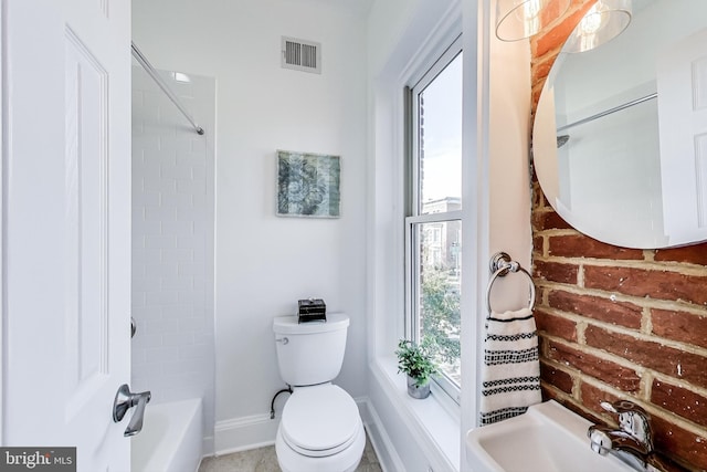251 8th St NE, Washington, DC 20002 - bathroom with a sink, toilet, baseboards, and shower / bath combination