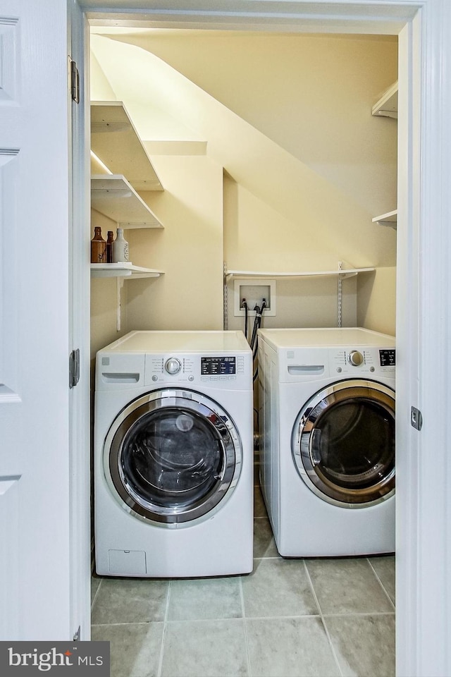 251 8th St NE, Washington, DC 20002 - laundry room with washing machine and clothes dryer and light tile patterned floors