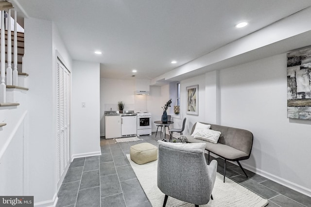 251 8th St NE, Washington, DC 20002 - living room with recessed lighting, dark tile patterned flooring, washer / clothes dryer, and baseboards