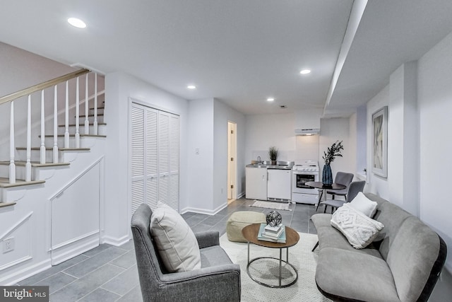 251 8th St NE, Washington, DC 20002 - living area with tile patterned flooring, recessed lighting, stairs, washer / clothes dryer, and baseboards