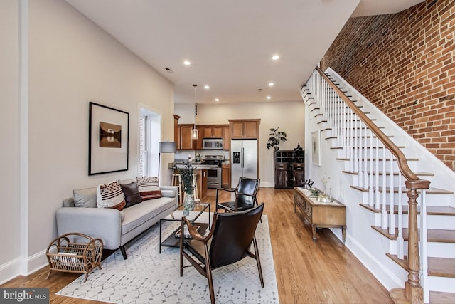 251 8th St NE, Washington, DC 20002 - living area with light wood-style floors, baseboards, recessed lighting, and stairs