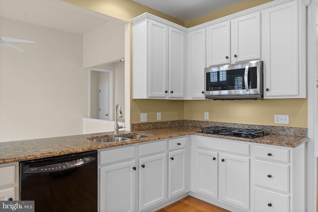 327 Astilbe Dr, Kennett Square, PA 19348 - kitchen with black appliances, a sink, and white cabinets
