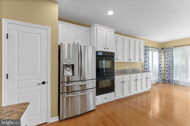 327 Astilbe Dr, Kennett Square, PA 19348 - kitchen featuring stainless steel fridge with ice dispenser, light wood finished floors, white cabinetry, light stone counters, and recessed lighting
