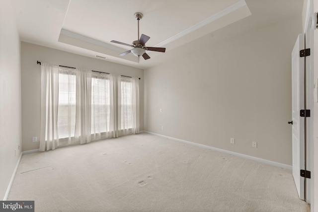 327 Astilbe Dr, Kennett Square, PA 19348 - spare room with a raised ceiling, light colored carpet, ceiling fan, baseboards, and crown molding