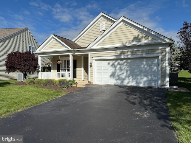 327 Astilbe Dr, Kennett Square, PA 19348 - view of front of home featuring covered porch, driveway, an attached garage, and a front lawn