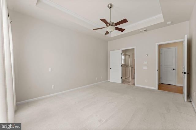 327 Astilbe Dr, Kennett Square, PA 19348 - unfurnished bedroom featuring a raised ceiling, crown molding, carpet flooring, ensuite bathroom, and baseboards