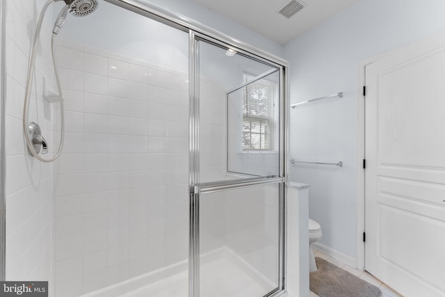 327 Astilbe Dr, Kennett Square, PA 19348 - full bathroom featuring a stall shower, toilet, and tile patterned floors