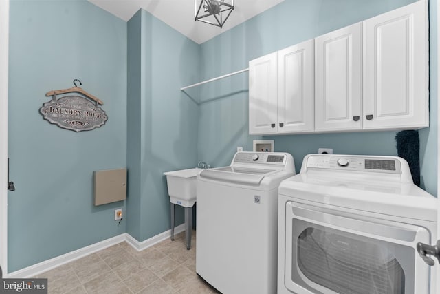 327 Astilbe Dr, Kennett Square, PA 19348 - laundry area featuring washer and clothes dryer, cabinet space, and baseboards
