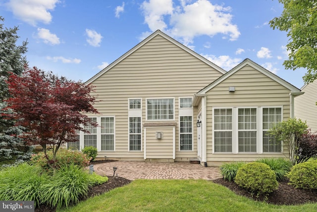 327 Astilbe Dr, Kennett Square, PA 19348 - rear view of house featuring a patio area and a lawn