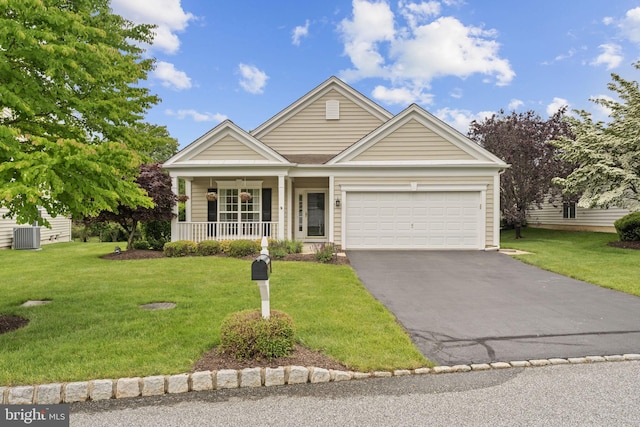 327 Astilbe Dr, Kennett Square, PA 19348 - view of front of house featuring a porch, driveway, an attached garage, and a front yard