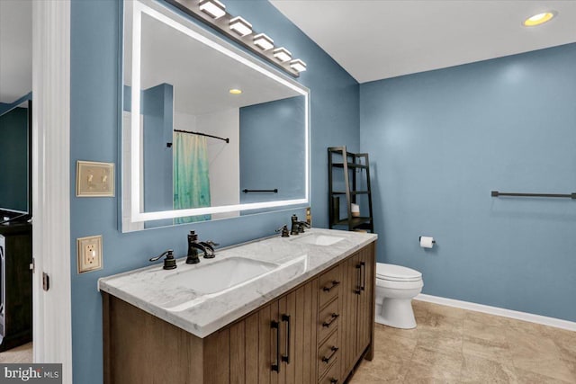 701 Antietam Dr, Douglassville, PA 19518 - bathroom with double vanity, toilet, baseboards, and a shower with shower curtain