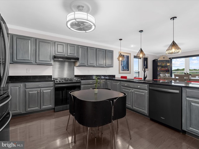 9112 Chesapeake Ave, Sparrows Point, MD 21219 - kitchen with appliances with stainless steel finishes, gray cabinetry, dark countertops, under cabinet range hood, and crown molding