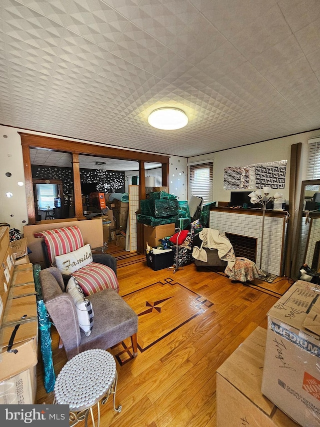 1666 Browning Rd, Pennsauken, NJ 08110 - living area with a brick fireplace and wood finished floors