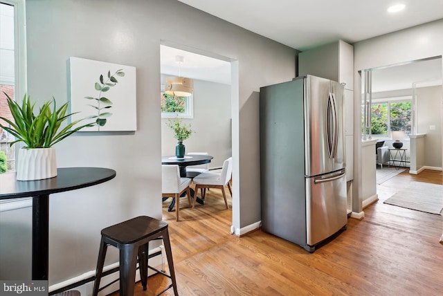10400 Conover Dr, Silver Spring, MD 20902 - kitchen with freestanding refrigerator, light wood finished floors, and baseboards