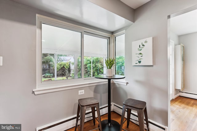 10400 Conover Dr, Silver Spring, MD 20902 - dining space featuring healthy amount of natural light, wood finished floors, and baseboards