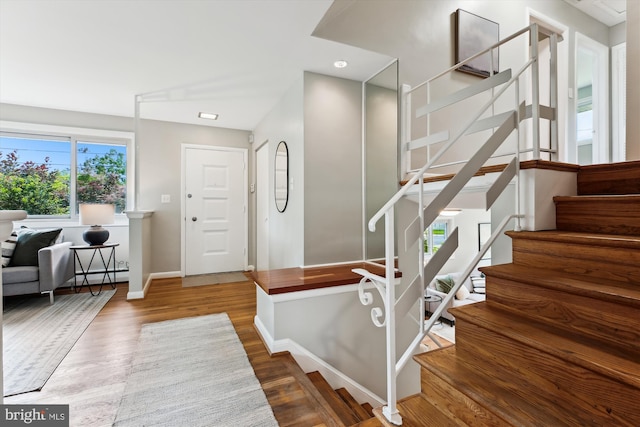 10400 Conover Dr, Silver Spring, MD 20902 - stairs featuring baseboards, wood finished floors, and baseboard heating