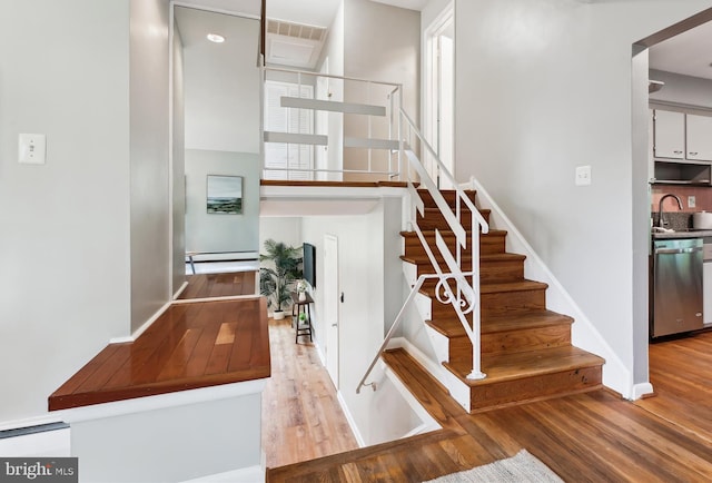 10400 Conover Dr, Silver Spring, MD 20902 - stairway featuring wood finished floors and baseboards