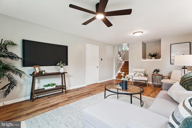 10400 Conover Dr, Silver Spring, MD 20902 - living room featuring stairs, wood finished floors, and baseboards