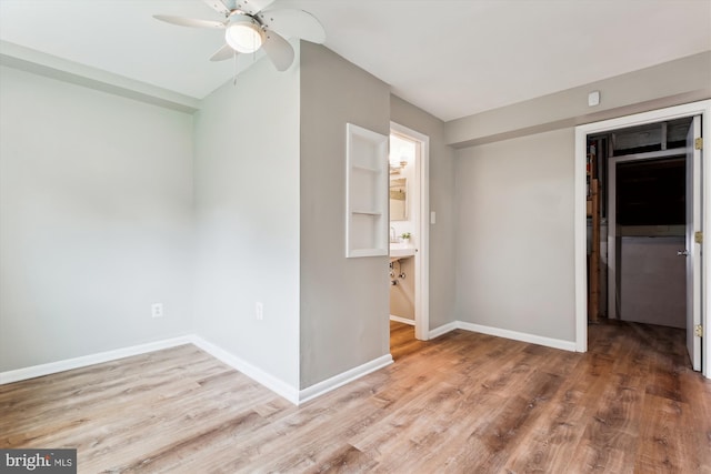 10400 Conover Dr, Silver Spring, MD 20902 - unfurnished bedroom with wood finished floors, baseboards, a spacious closet, and lofted ceiling