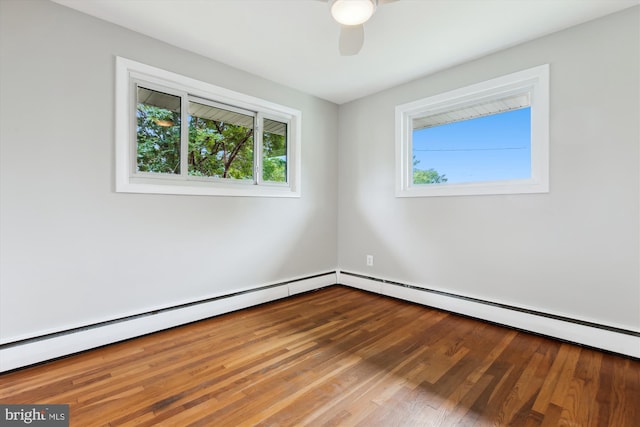 10400 Conover Dr, Silver Spring, MD 20902 - empty room with wood finished floors, ceiling fan, and a baseboard heating unit