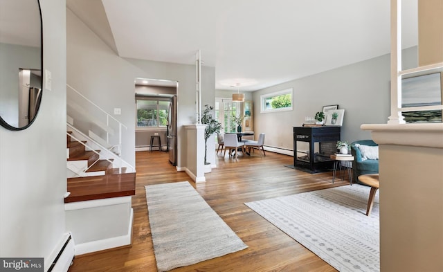 10400 Conover Dr, Silver Spring, MD 20902 - entrance foyer with a baseboard radiator, stairs, and wood finished floors