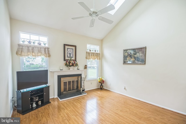 56 Ridgewood Way, Burlington, NJ 08016 - living room with a glass covered fireplace, wood finished floors, plenty of natural light, ceiling fan, and high vaulted ceiling