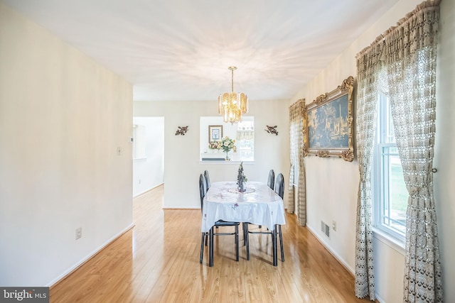 56 Ridgewood Way, Burlington, NJ 08016 - dining area featuring a chandelier, light wood-style flooring, and baseboards