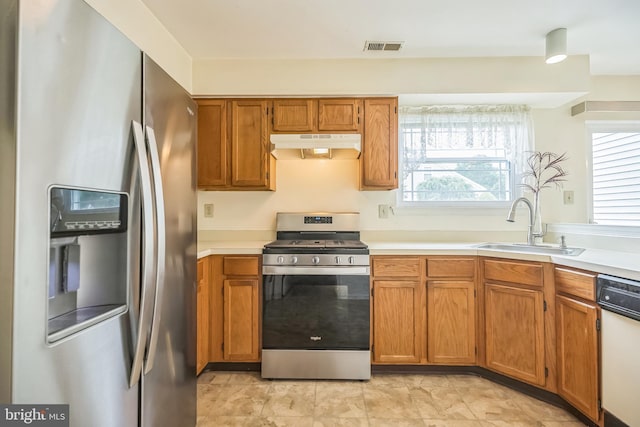 56 Ridgewood Way, Burlington, NJ 08016 - kitchen featuring stainless steel appliances, under cabinet range hood, a sink, light countertops, and brown cabinetry